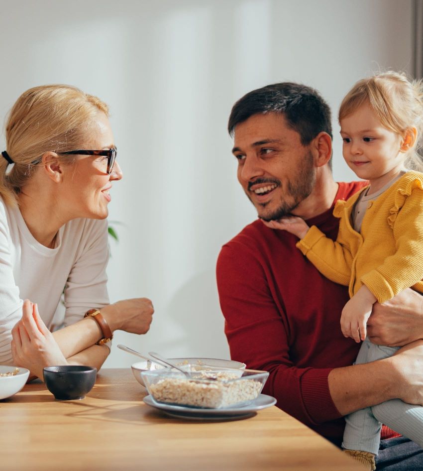 family sitting at a table talking about plasma donation