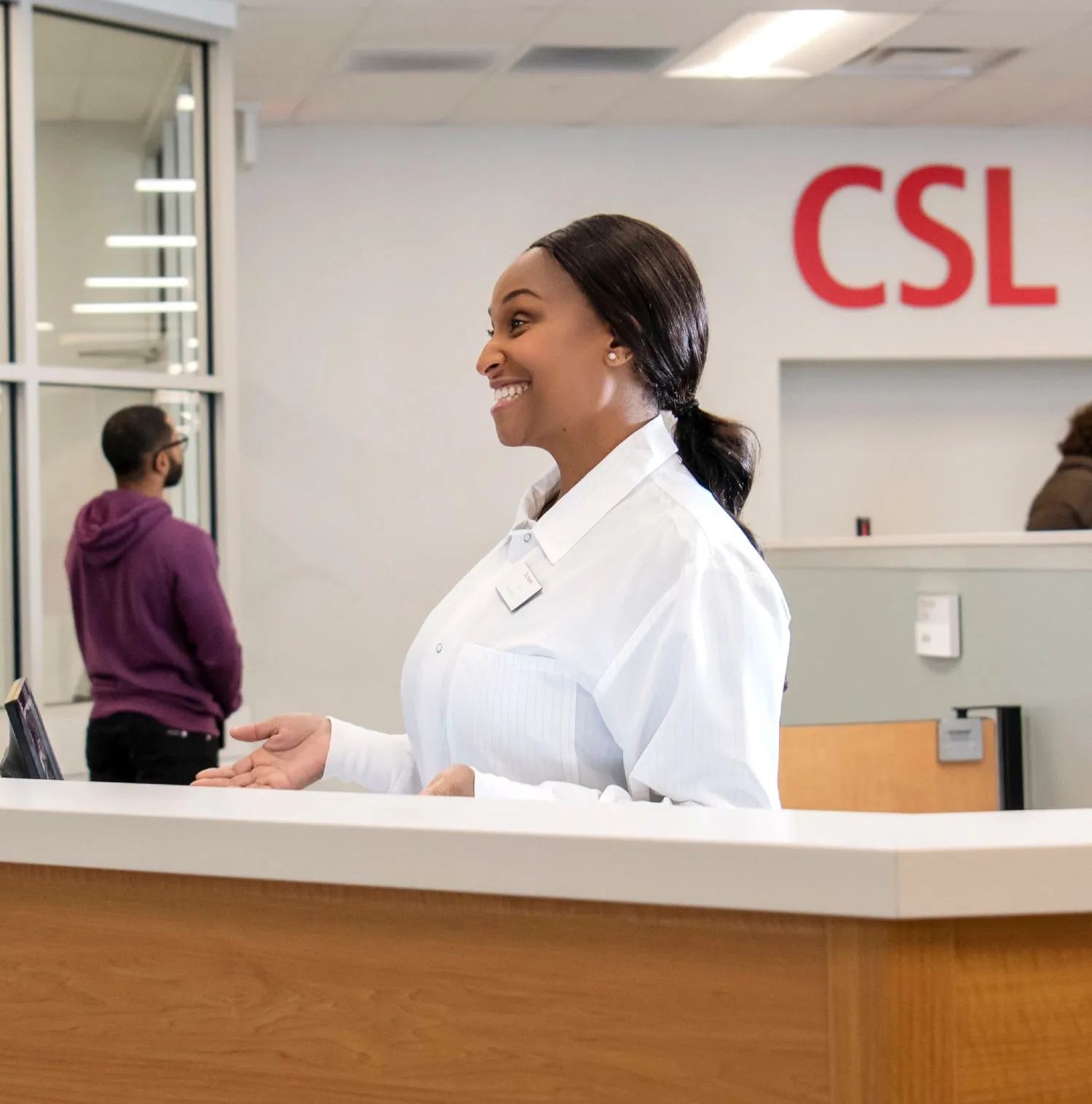 Woman checking in at CSL Plasma